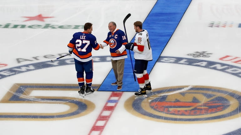 Former New York Islanders captain Ed Westfall drops the ceremonial...