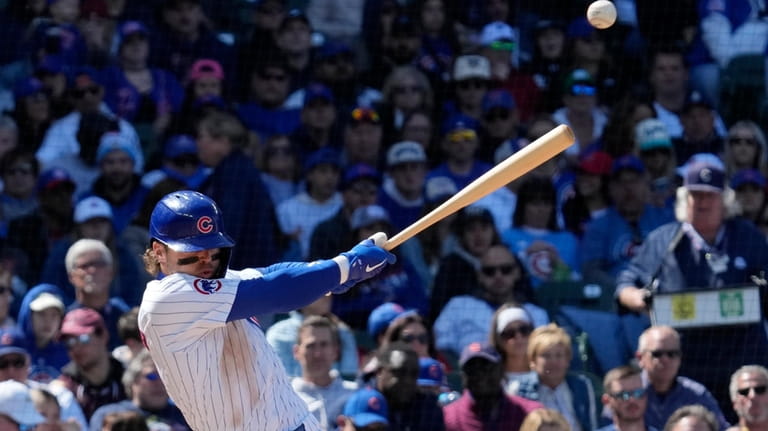 Chicago Cubs' Nico Hoerner hits a one-run double against the...