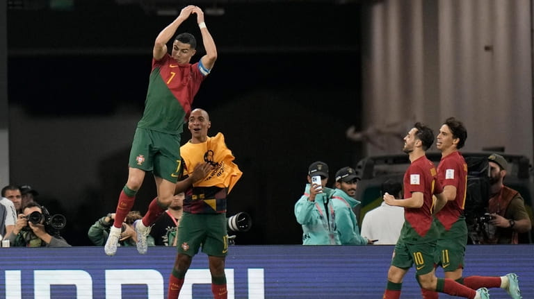 Portugal's Cristiano Ronaldo celebrates after scoring his side's first goal...