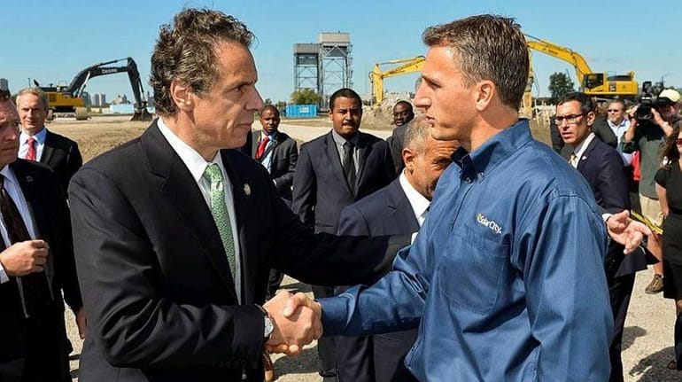 Gov. Andrew M. Cuomo with Lyndon Rive, co-founder and chief...
