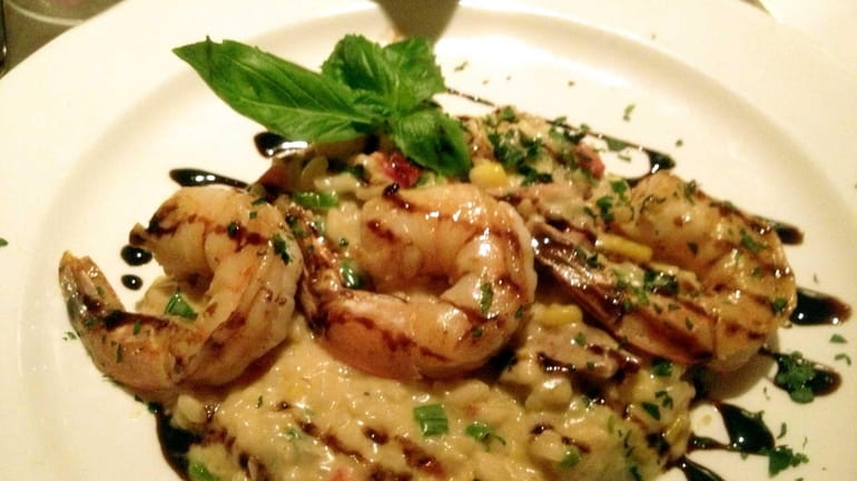 Shrimp-and-chorizo risotto is an appetizer at Eric's Italian Bistro in...