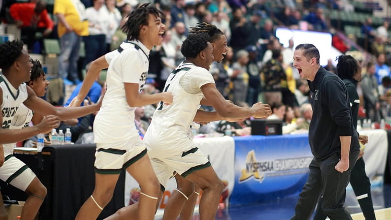 Elmont celebrates after defeating West Genesee in the state Class...