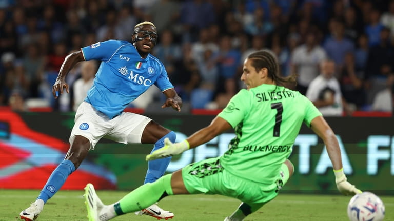 Napoli's Victor Osimhen, left, scores their side's second goal of...