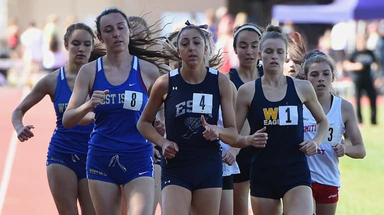 Runners compete in the Division Two 1500 Meter Run during...