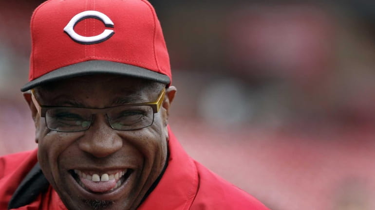 Cincinnati Reds manager Dusty Baker laughs as he watches batting...