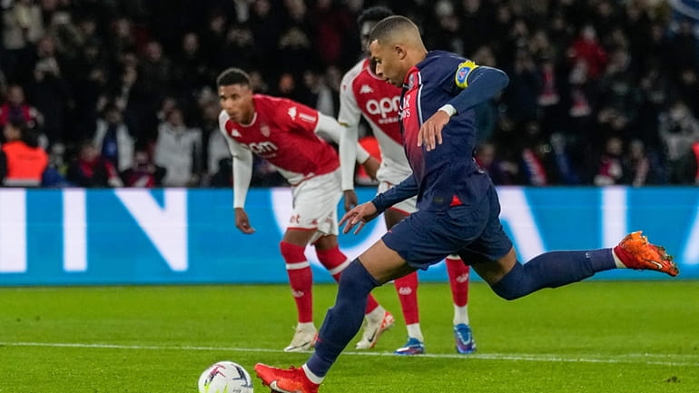 PSG's Kylian Mbappe scores his side's second goal from penalty...