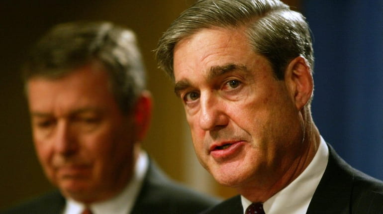 Former F.B.I. Director Robert Mueller, right, and U.S. Attorney General...