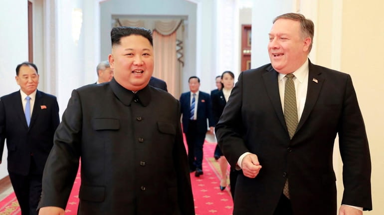 North Korean leader Kim Jong Un, center left, and U.S....