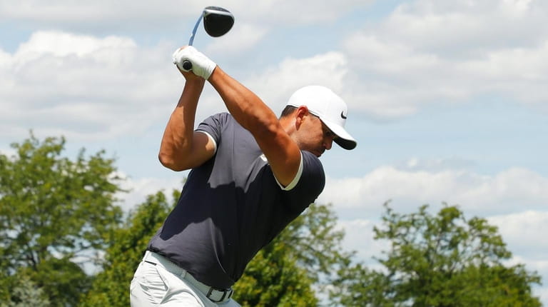 Brooks Koepka plays his shot from the 12th tee during...