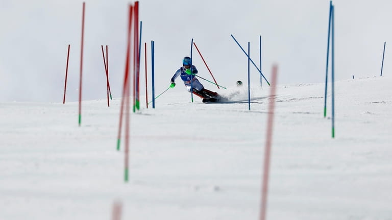 Norway's Timon Haugan competes in the first run of an...