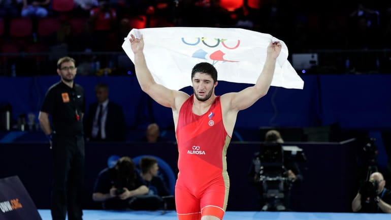 Russia's Abdulrashid Sadulaev celebrates winning the final in 97kg at...