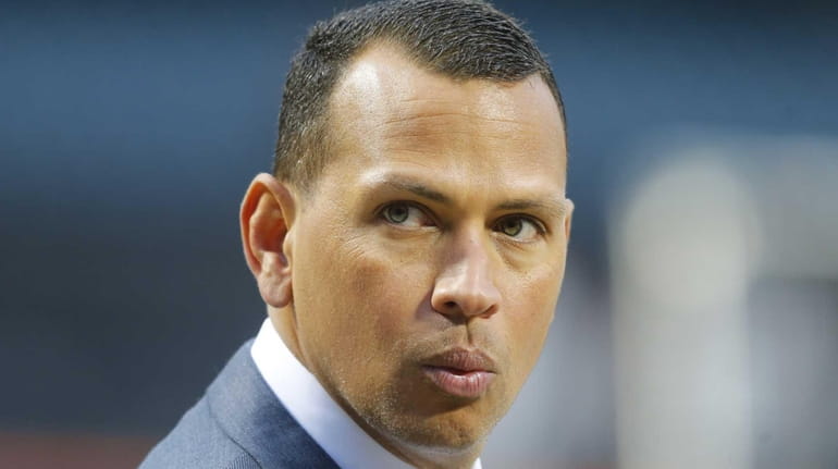The New York Yankees' Alex Rodriguez looks on before Game...
