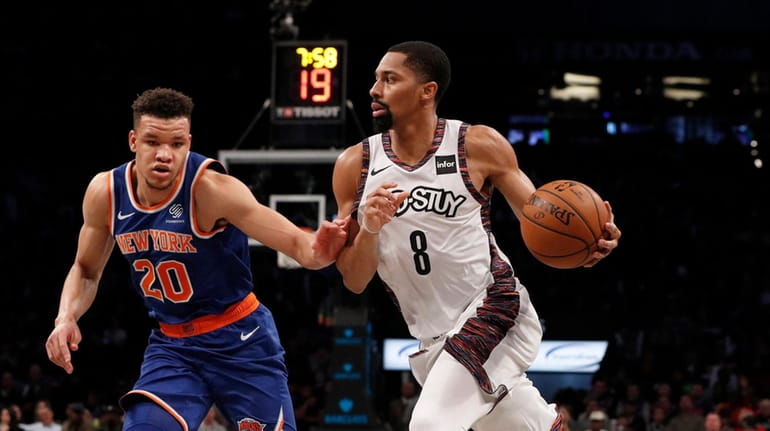 Spencer Dinwiddie #8 of the Brooklyn Nets drives to the...