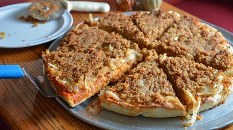 The old fashioned Sicilian pizza, with sauteed onions, marinara sauce,...