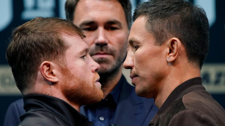 Canelo Alvarez, left, and Gennady Golovkin, right, pose during a...
