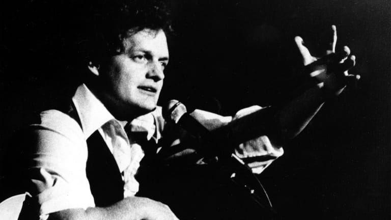  Harry Chapin performing at Avery Fisher Hall in New York...