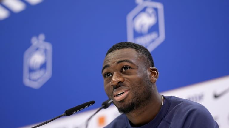 France's Youssouf Fofana answers questions during a press conference at...