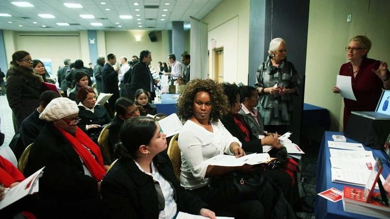 Job seekers attend a workshop at the New York Career...