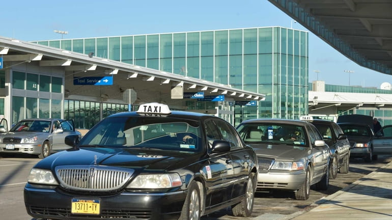 A line of taxis wait for customers at Long Island...