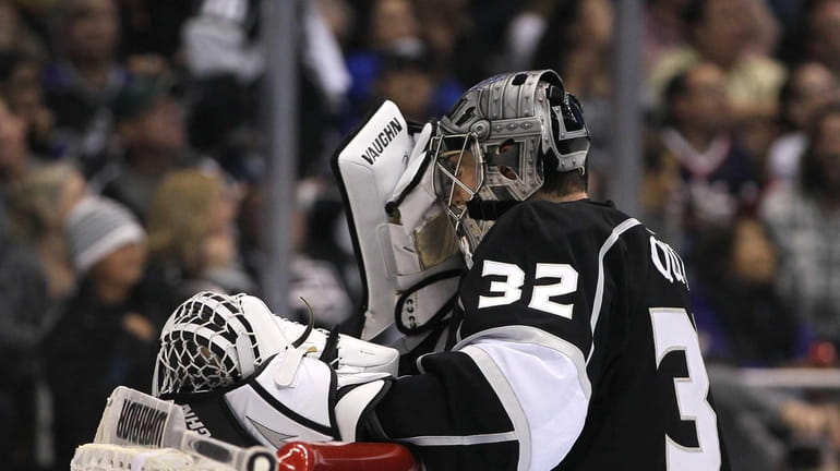 Goaltender Jonathan Quick of the Los Angeles Kings reacts after...