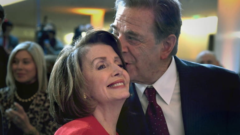 Democratic House Speaker Nancy Pelosi with her husband, Paul Pelosi,...