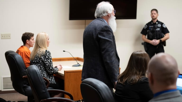 Latah County Prosecutor Bill Thompson, standing, addresses the court during...