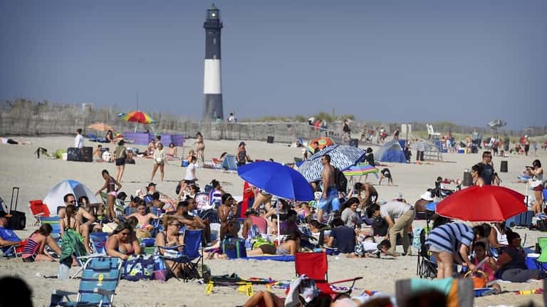 Crowds gather at the beach at Robert Moses State Park.