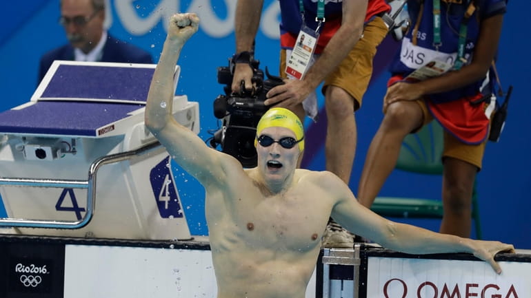 Australia's Mack Horton celebrates after winning the gold medal after...