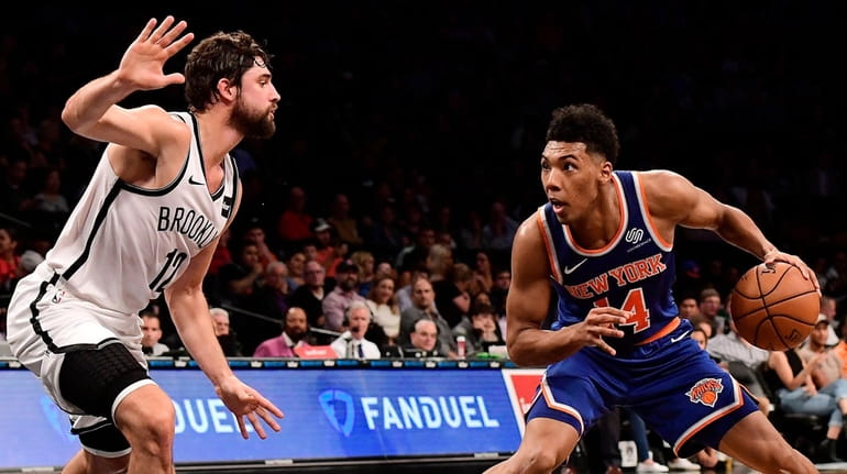 Allonzo Trier #14 of the New York Knicks is defended...