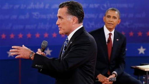 Republican presidential nominee Mitt Romney answers a question as President...