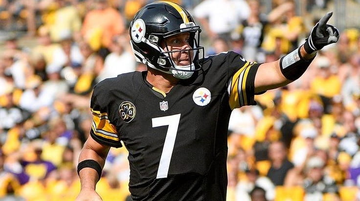 Ben Roethlisberger of the Steelers scrambles out of the pocket...