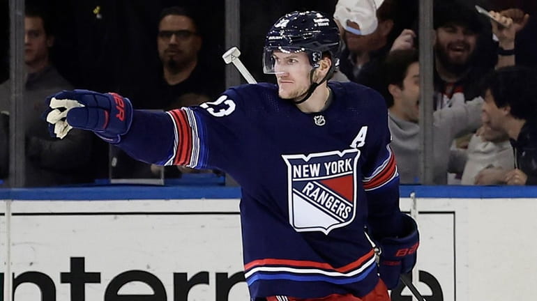 Adam Fox of the Rangers celebrates his second-period power play goal...