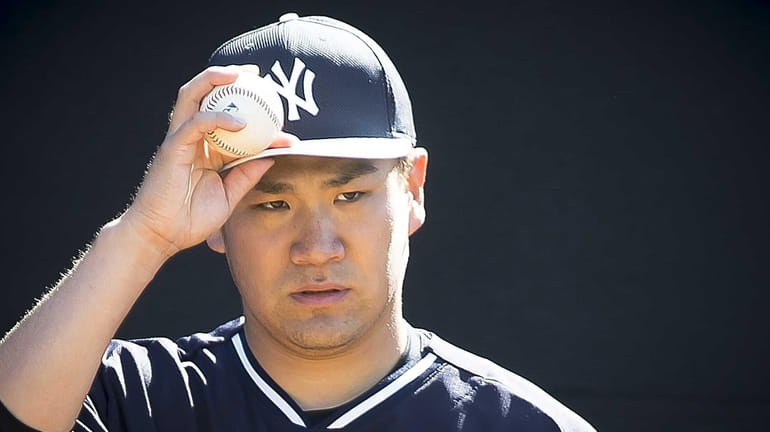 New York Yankees pitcher Masahiro Tanaka throws in the bullpen...