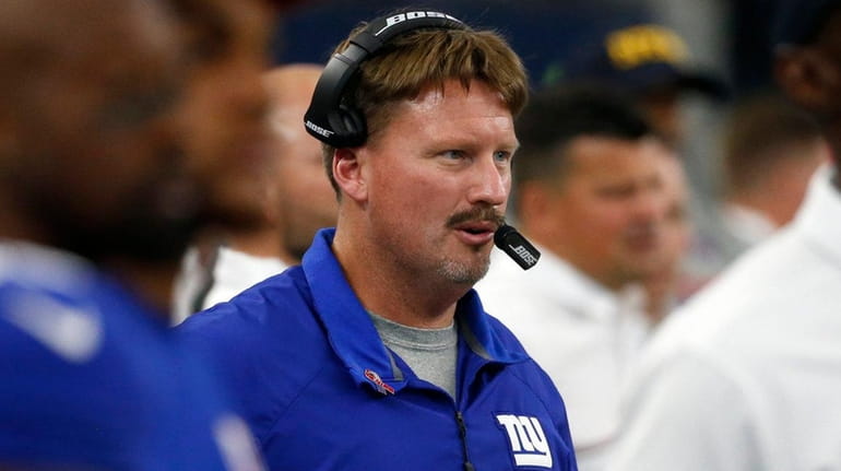 New York Giants head coach Ben McAdoo watches play against...