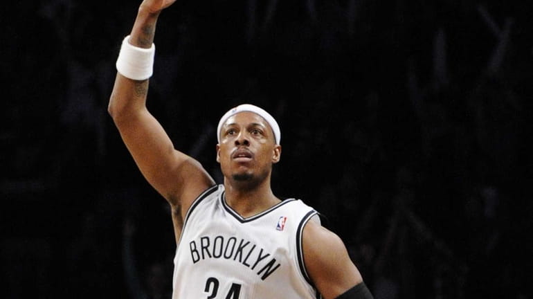 Paul Pierce reacts after sinking a three-pointer in the second...