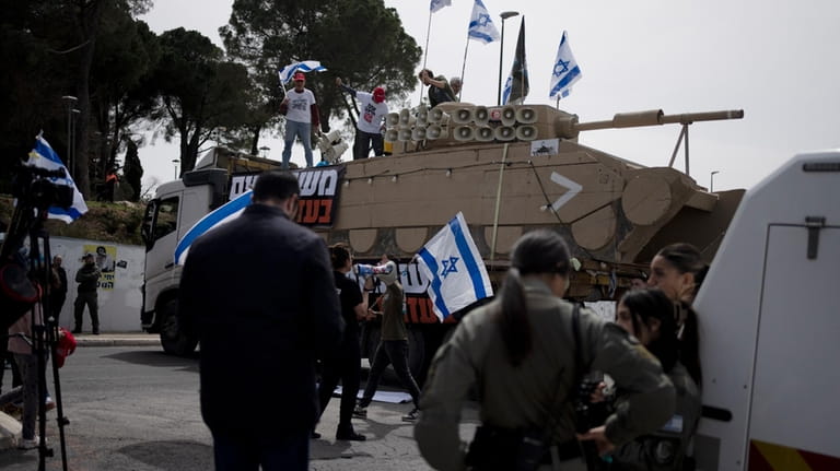 Members of Brothers and Sisters in Arms protest against Israel's...