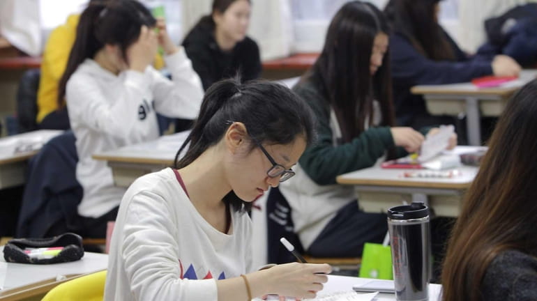 South Korean students take their College Scholastic Ability Test at...