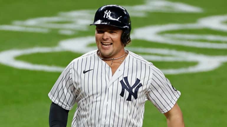 Yankees' Luke Voit celebrates hitting a three-run home run during...