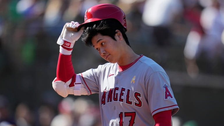 Los Angeles Angels' Shohei Ohtani walks to the dugout after...