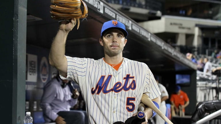 David Wright of the New York Mets waves to fans...