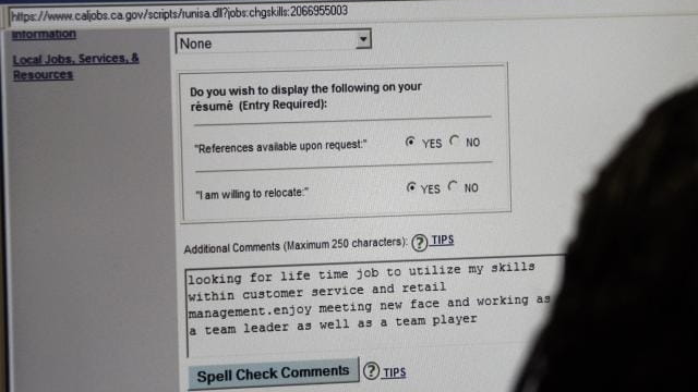 A job seeker fills out a computer resume at the...