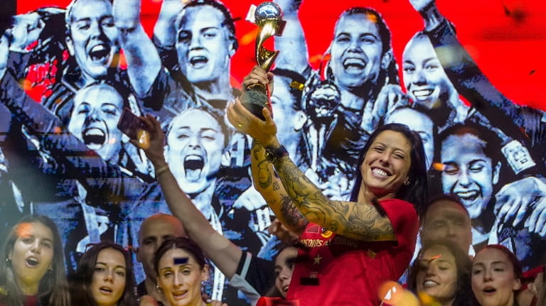Spain's Jennifer Hermoso holds the trophy as they celebrate their...
