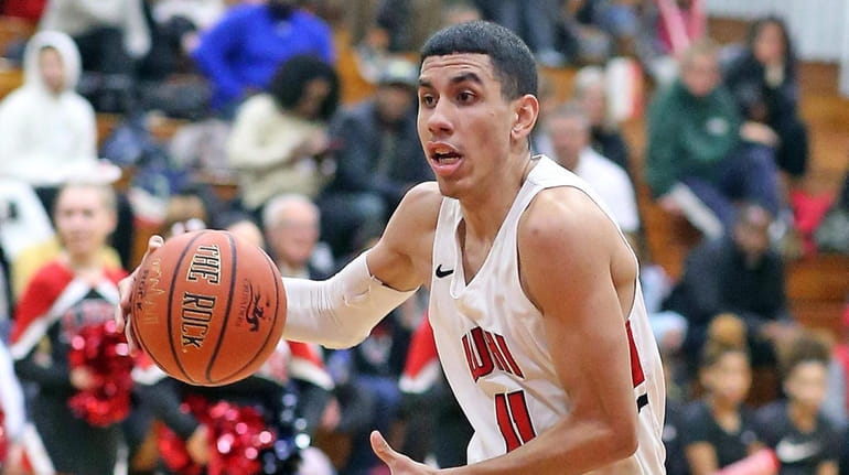 Long Island Lutheran's Andre Curbelo flies up the middle as...