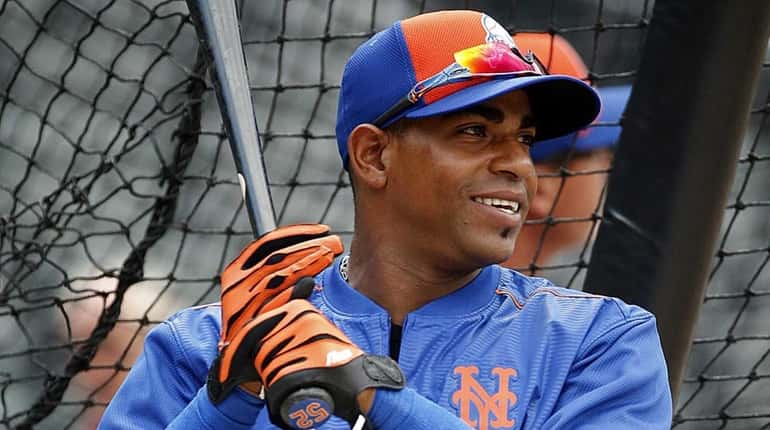 New York Mets leftfielder Yoenis Cespedes takes batting practice before...