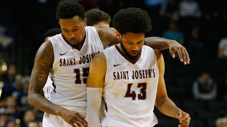 Isaiah Miles #15 and DeAndre Bembry #43 of the Saint...