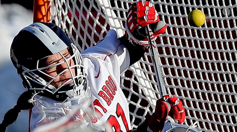 Stony Brook goalie Anna Tesoriero with the save by deflection...