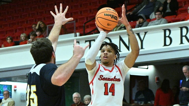 Stony Brook guard Tyler Stephenson-Moore shoots from the outside past...