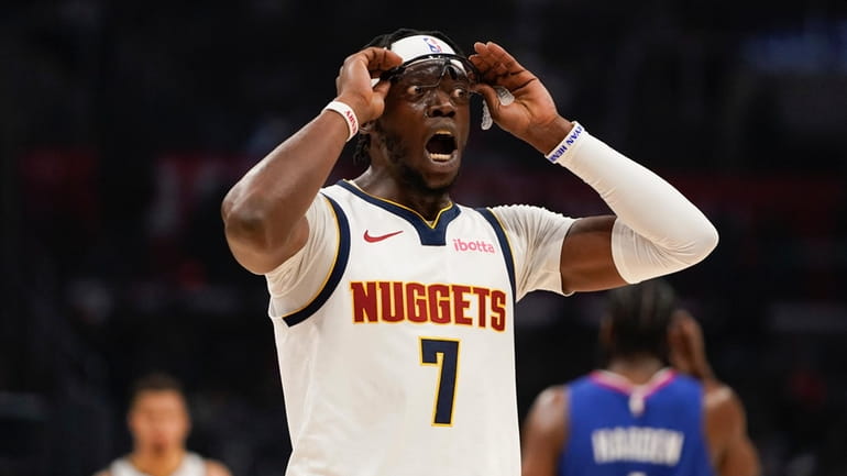 Denver Nuggets guard Reggie Jackson reacts during the first half...
