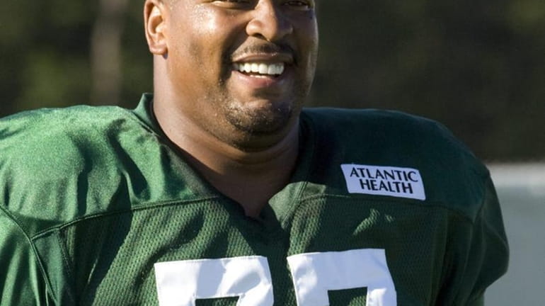 Jets defensive tackle Kris Jenkins is all smiles when he...