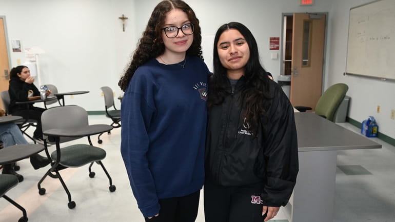 Molloy University student Katie Sandoval, left, is mentoring Roosevelt High...